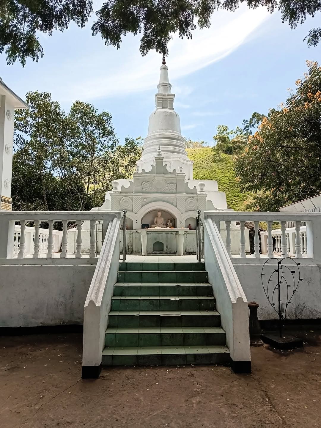 Ancient Dhowa Rock Temple with unfinished Buddha carving and cave shrines
