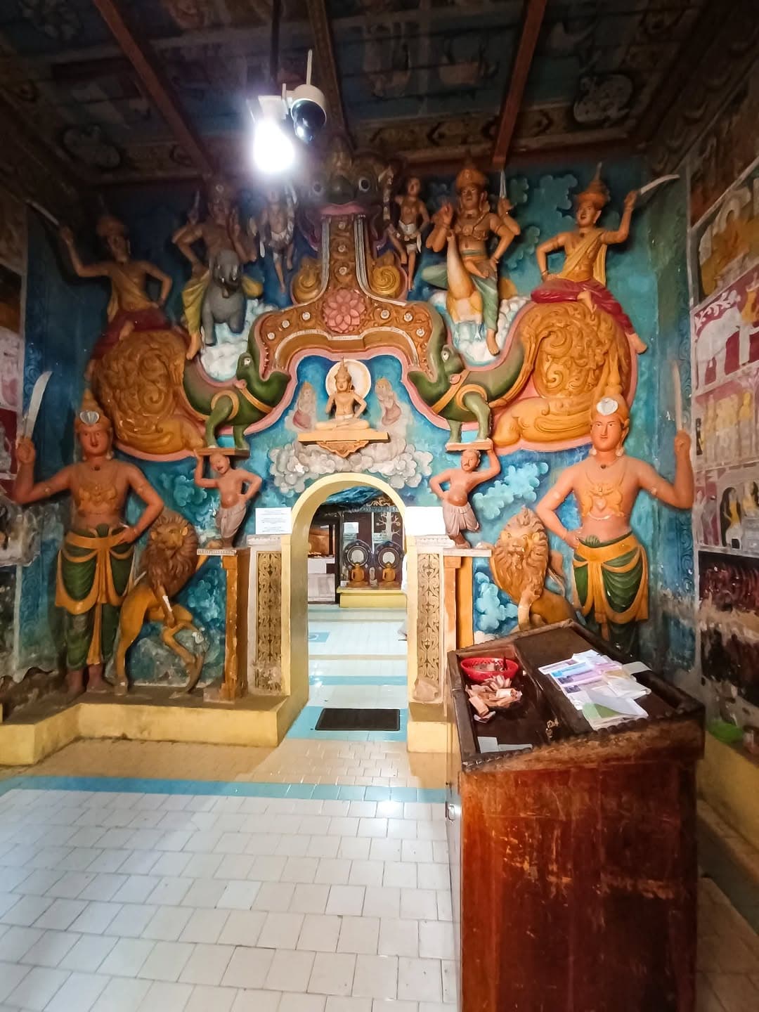 Ancient Dhowa Rock Temple with unfinished Buddha carving and cave shrines