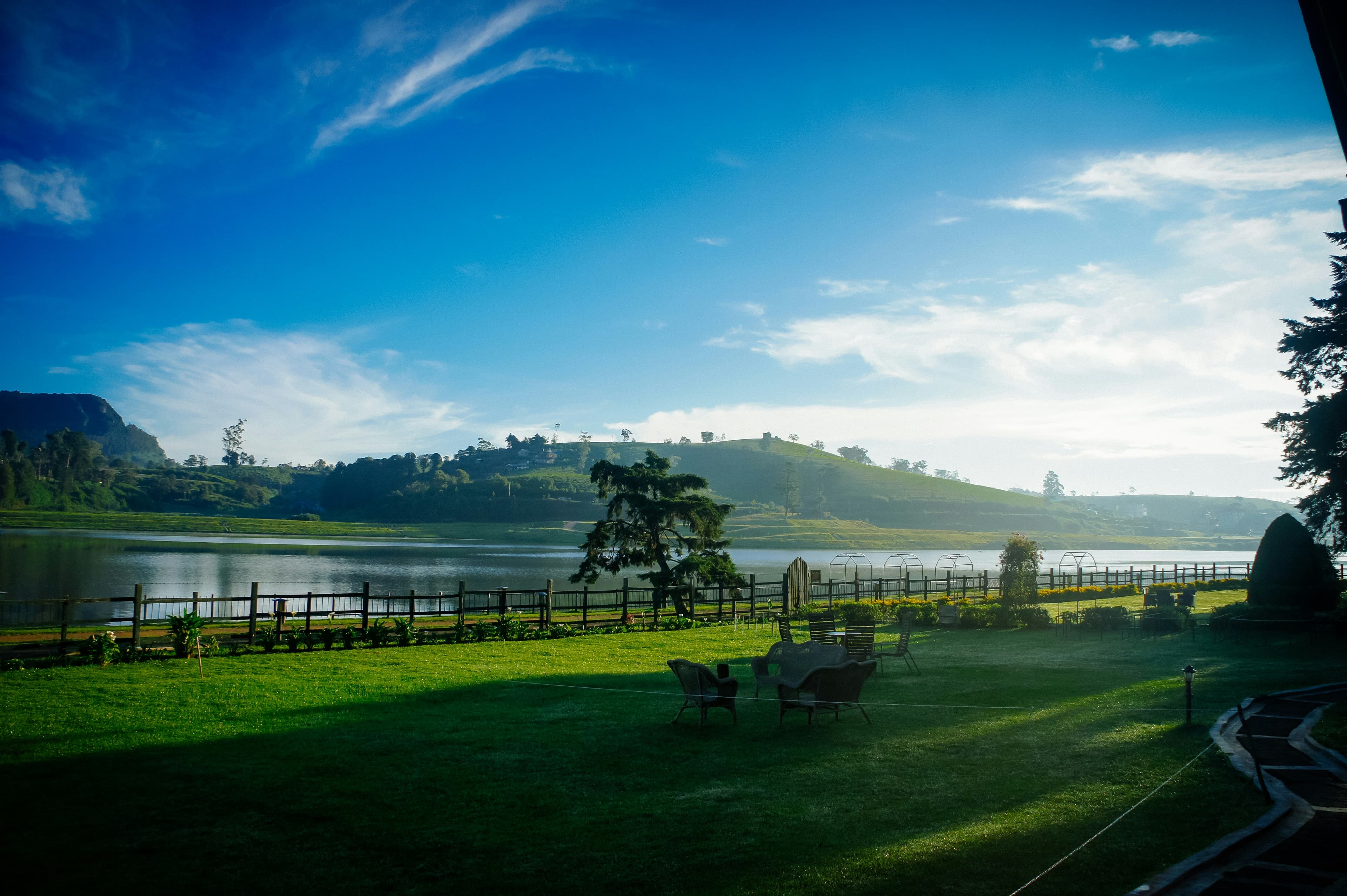 Beautiful Gregory Lake in Nuwara Eliya with paddle boats, walking paths, and surrounding hills