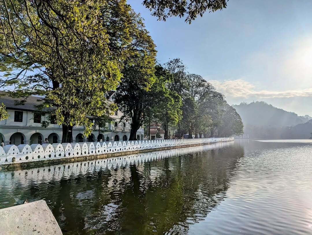 Beautiful view of Kandy Lake with Temple of the Tooth and surrounding hills in Sri Lankas cultural capital