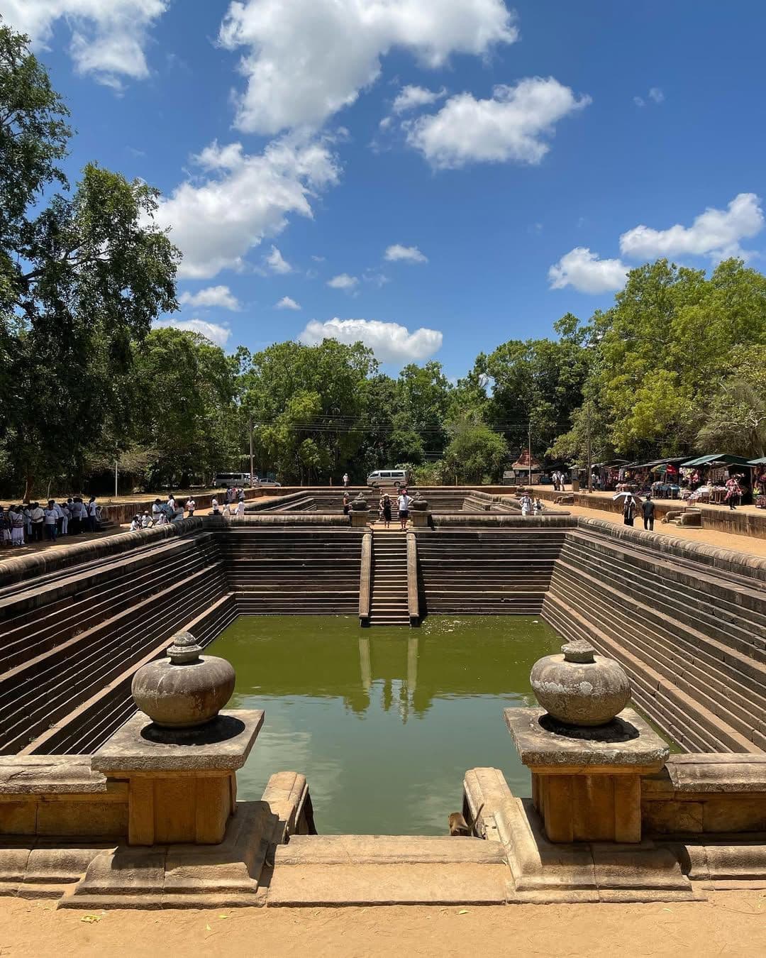 Magnificent aerial view of Kuttam Pokuna twin pools showing ancient stepped architecture and crystal-clear water in Anuradhapura, Sri Lanka
