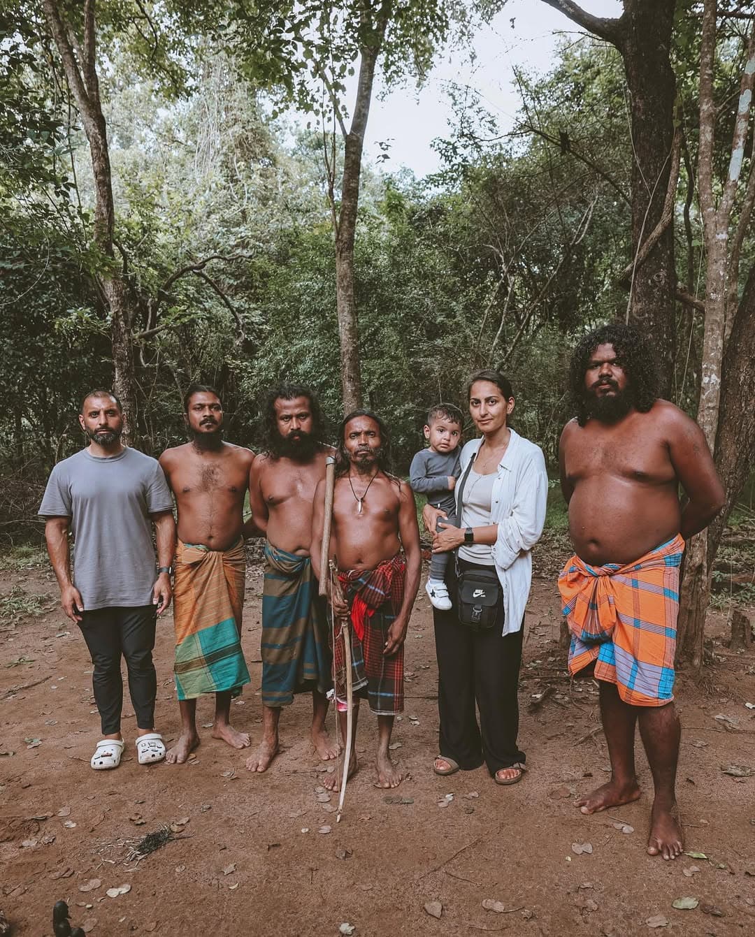 Vedda people demonstrating traditional hunting techniques in Dambana village