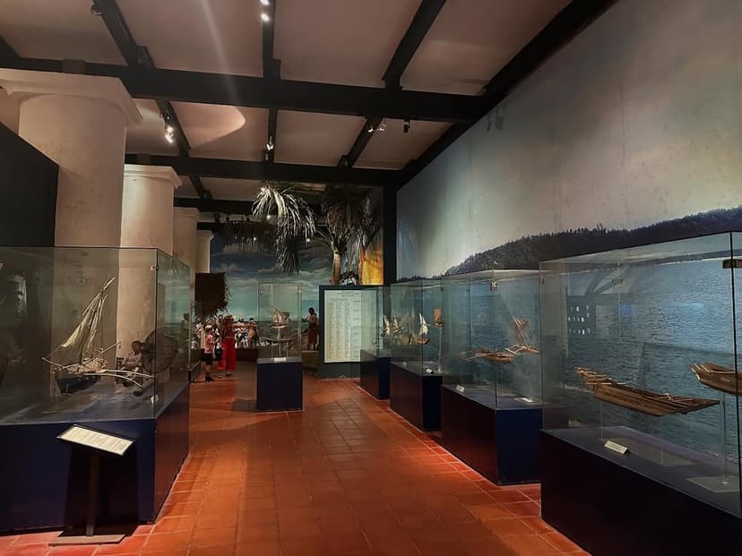Maritime museum displays showing ancient ship models and colonial trading artifacts