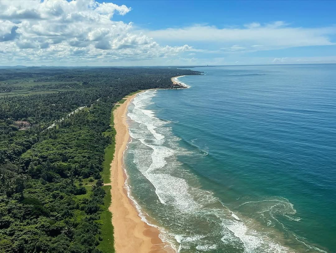 Para Motoring over Bentota Beach with stunning coastal views