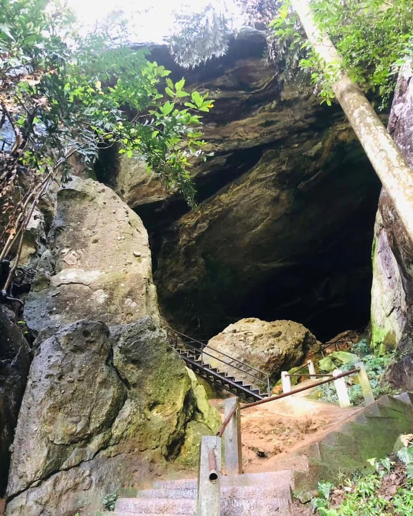 Historic Ravana Cave entrance with ancient stone work and steps