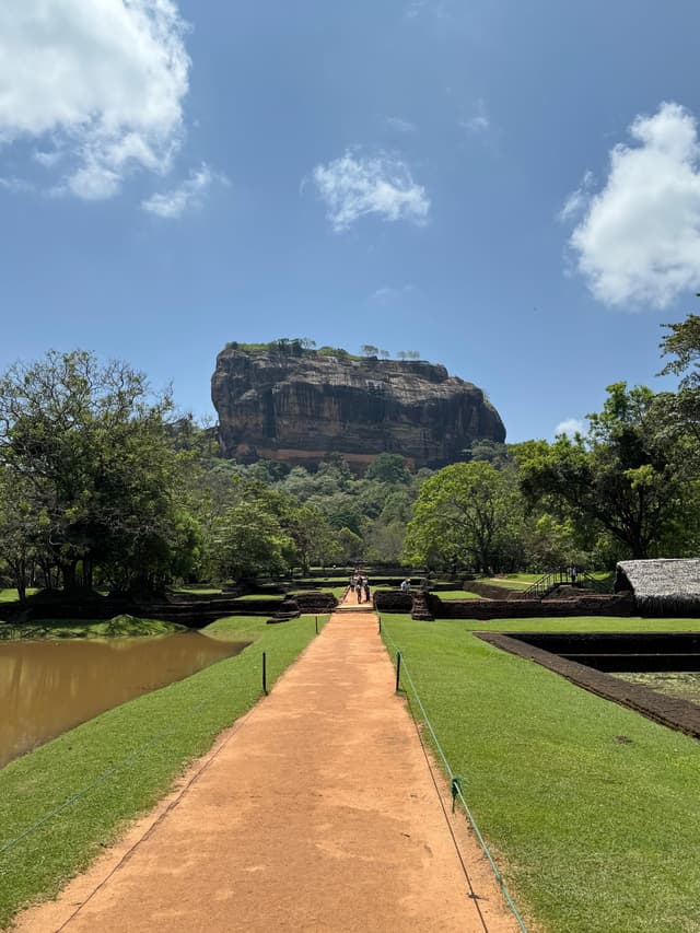 Sigiriya Rock Fortress with lion paws and ancient frescoes on a massive rock column