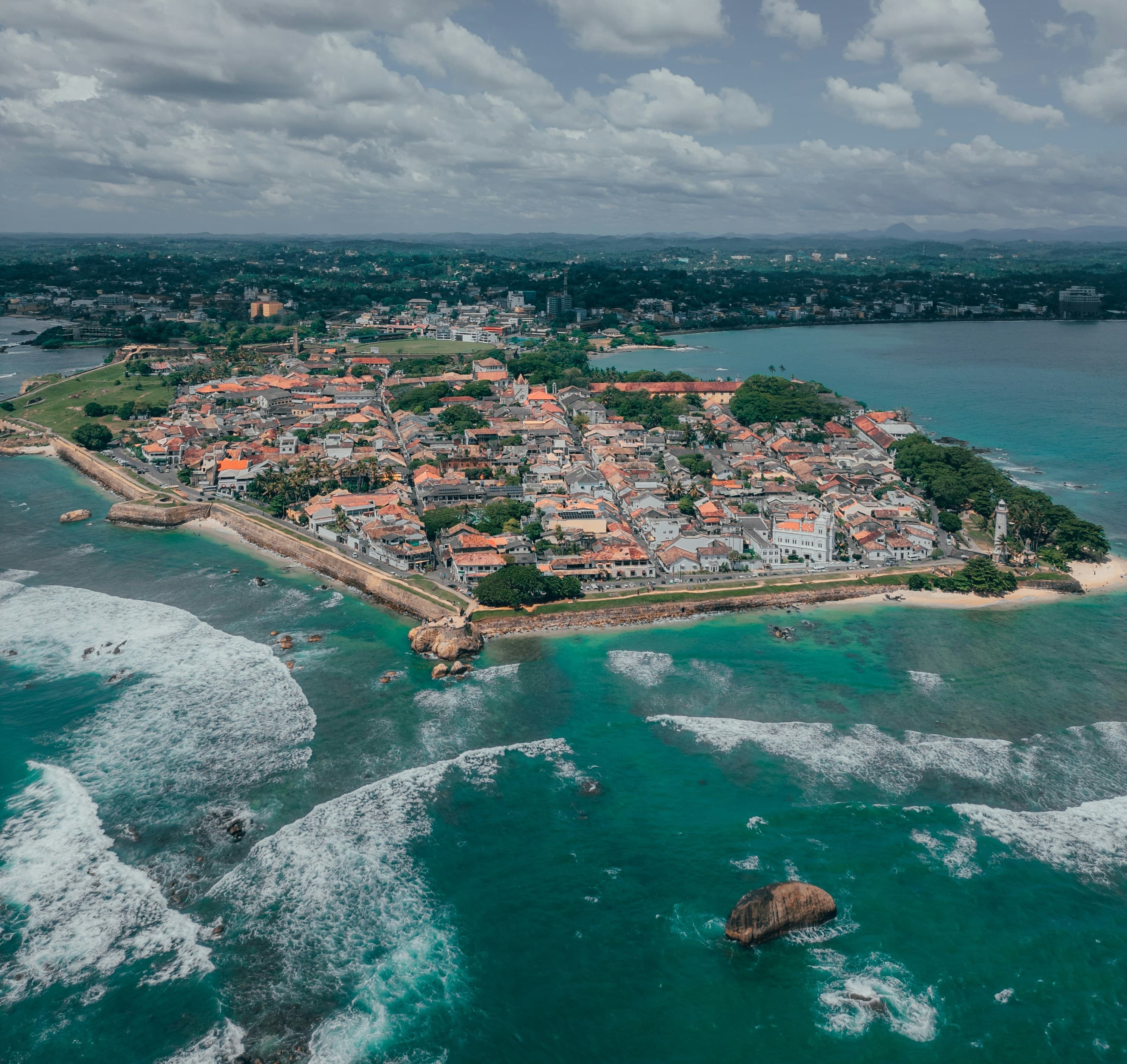 Stunning aerial view of Galle Fort showing Dutch colonial architecture surrounded by Indian Ocean waves